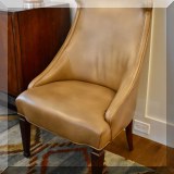 F10. One of a pair of Century Funiture leather captain's chairs. 